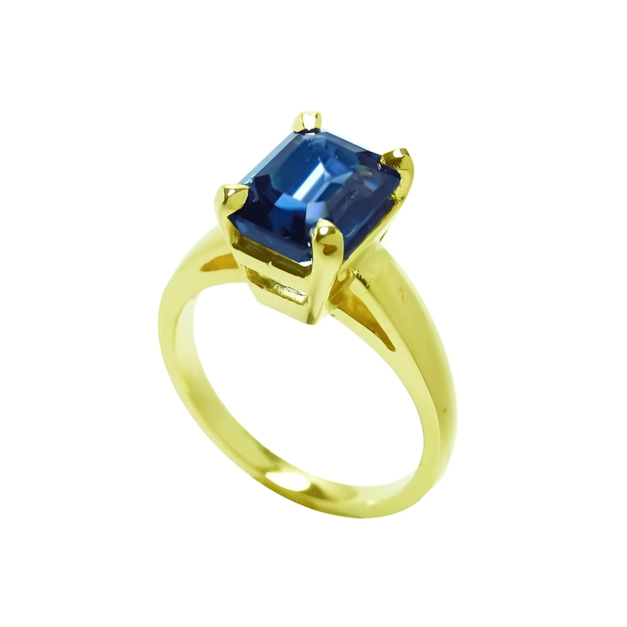 3.13 ct. deep blue emerald cut sapphire solitaire ring in 14K yellow gold.