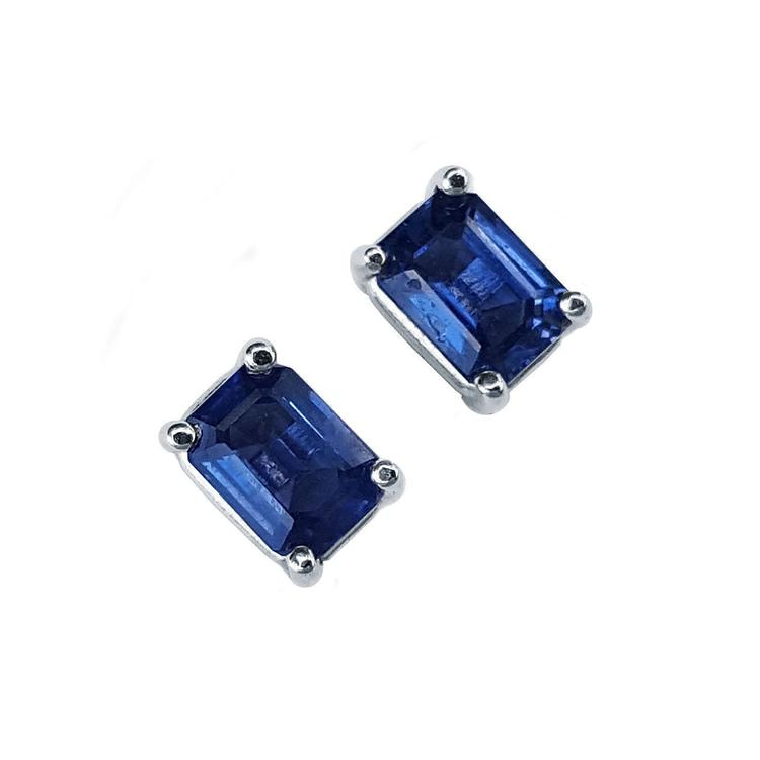 Pair of emerald-cut natural deep blue sapphire solitaire stud earrings in 14K white gold, four-prong setting.