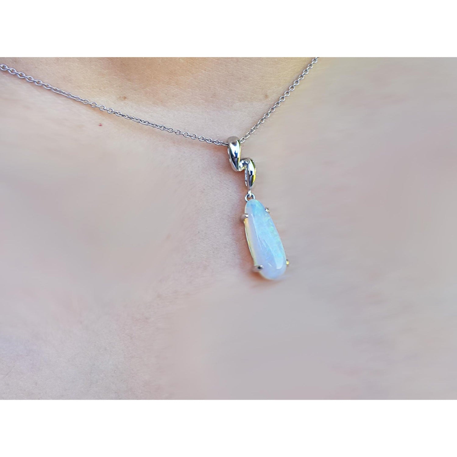 Necklace with a teardrop-shaped pendant on a person&#39;s neck