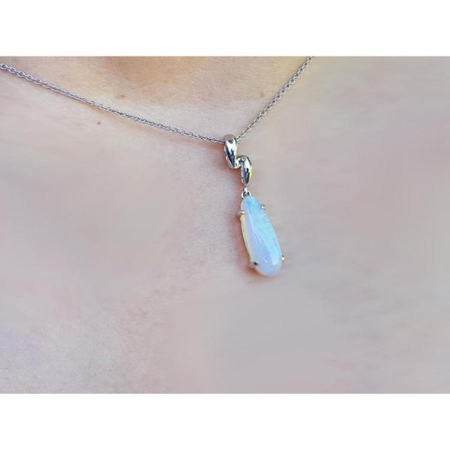 1.56 ct bluish-green opal pendant in 14K white gold, worn on a delicate chain.