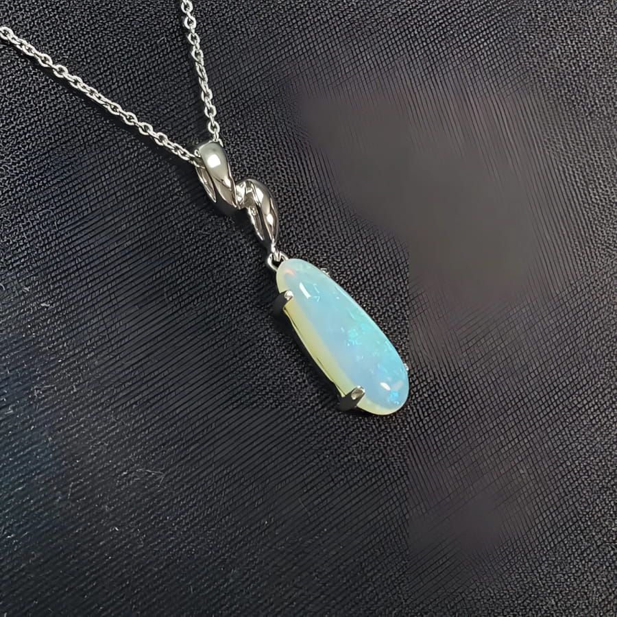 1.56 ct bluish-green opal pendant in 14K white gold, elongated pear shape.