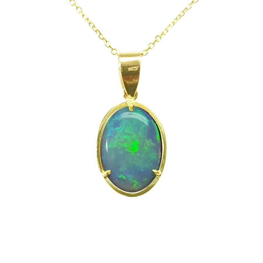 Oval bluish-green Australian opal pendant in 14K yellow gold with three prongs on a delicate chain.