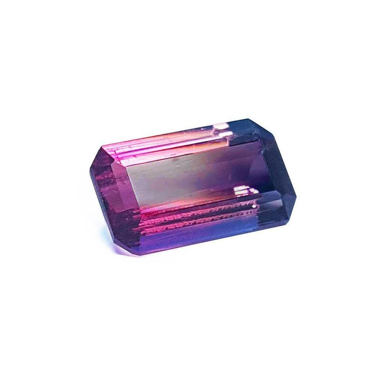 A brazilian watermelon tourmaline displaying the topside view, table and crown facets visibles.