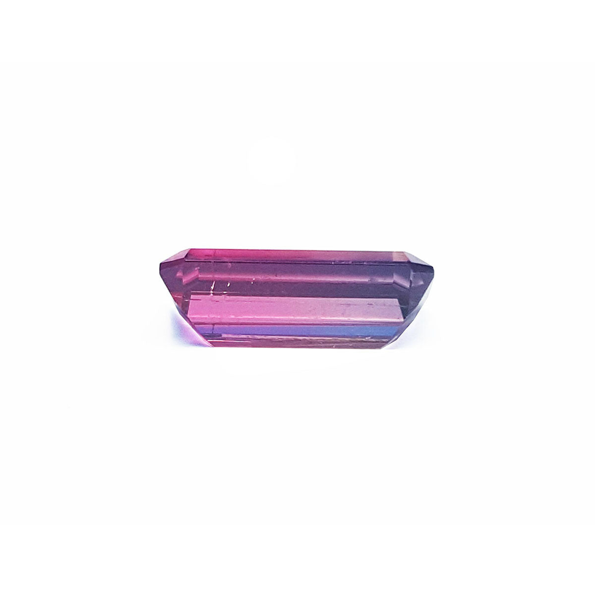 A pink tourmaline displaying the underside girdle and pavilion view.