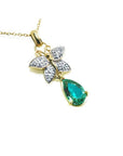 14k gold butterfly pendant with natural teardrop emerald and diamond accents.