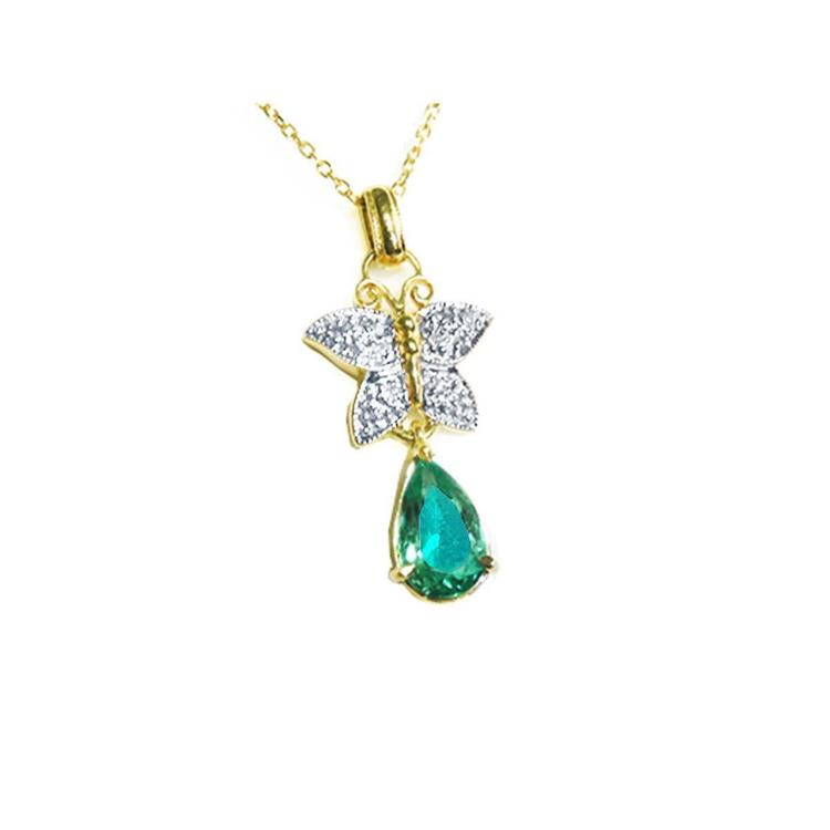 Gold necklace with a natural emerald teardrop pendant and butterfly design on a topside view.