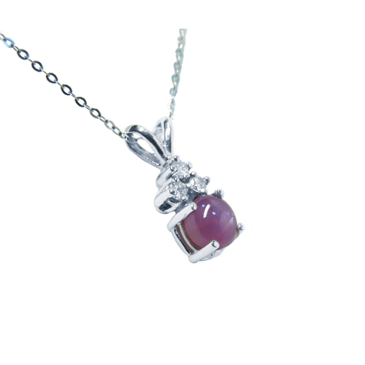 A natural pink sapphire necklace with pendant in 14k white gold.