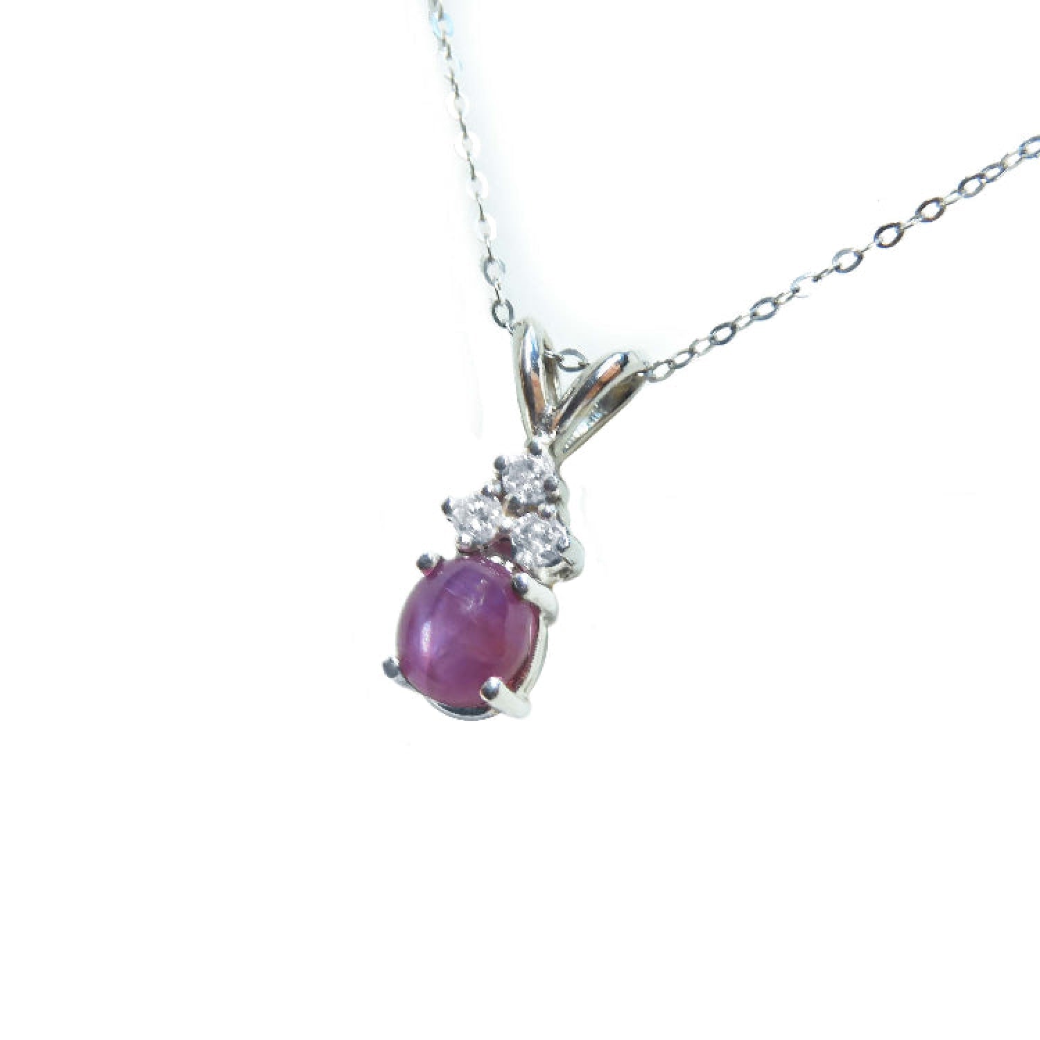 Oval cabochon pink sapphire pendant necklace in 14k white gold.
