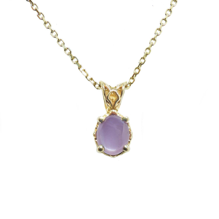 An oval-cut solitaire cabochon pink sapphire pendant necklace showcasing a 1.30 ct stone with a medium sparkle hue. 
