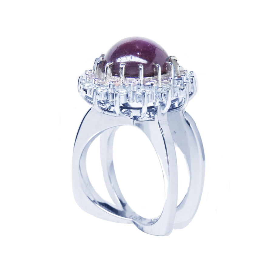 Red purple cabochon star ruby women's ring half-side top view in a double halo natural diamonds