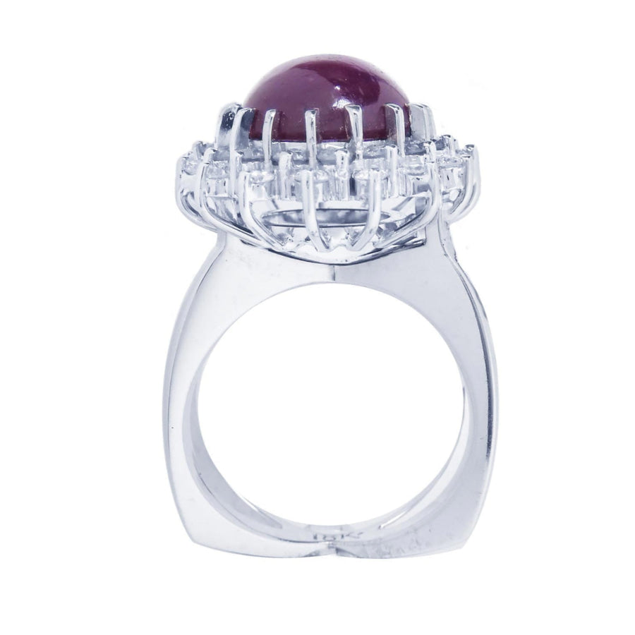 Red purple cabochon star ruby women's ring tall top view in a double halo natural diamonds