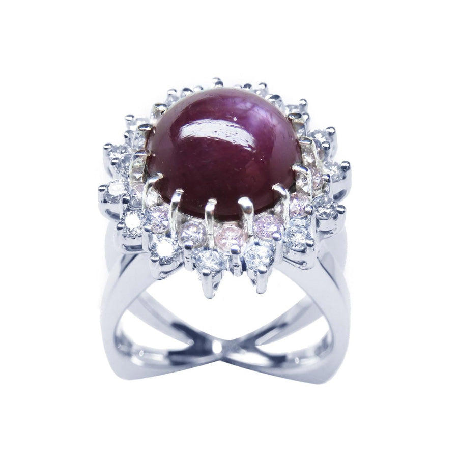 Red purple cabochon star ruby women's ring front high top view in a double halo natural diamonds