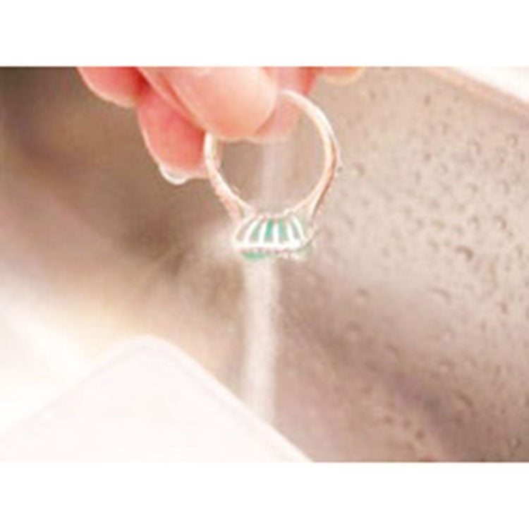 Flushing clean faucet water to remove soapy water after brushing.