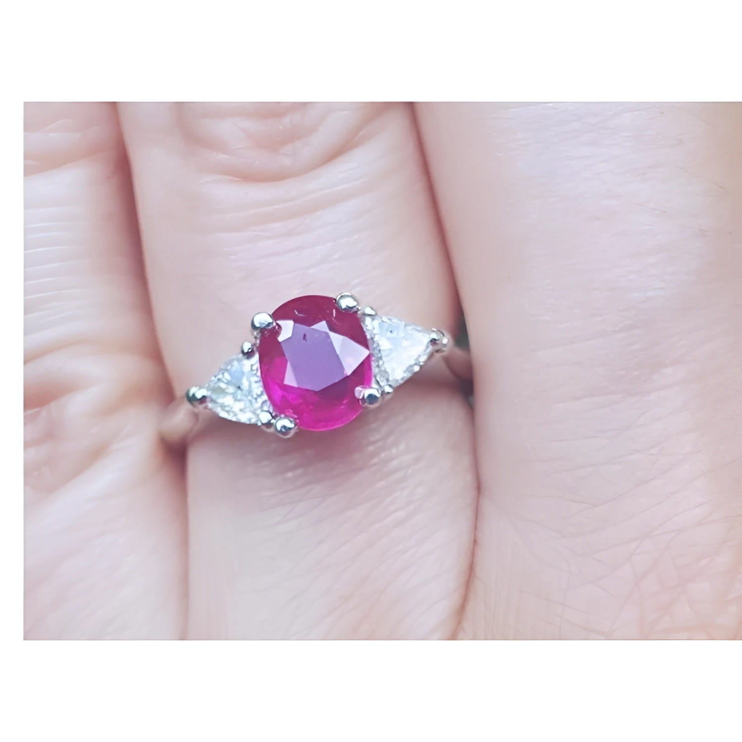 Women's 1.59 ct Burma Ruby ring with trillion side diamonds in 14k white gold.