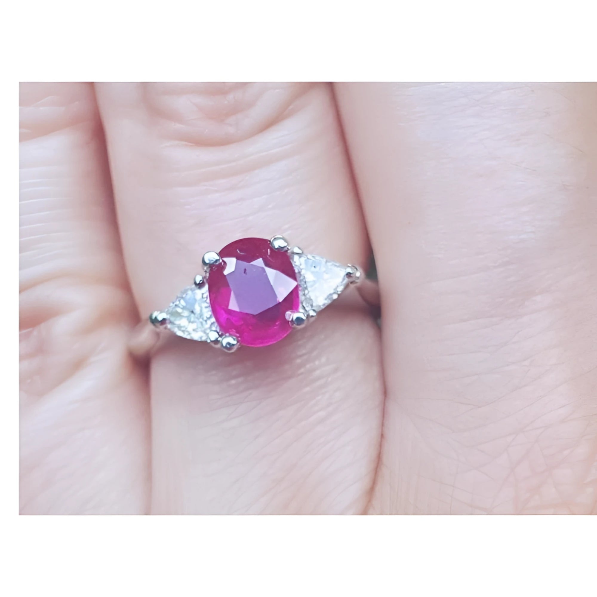 Women's 1.59 ct Burma Ruby ring with trillion side diamonds in 14k white gold.