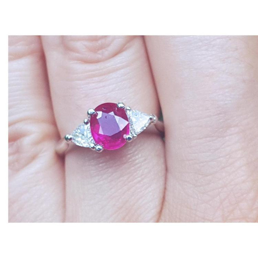 Women's 1.59 ct Burma Ruby ring with trillion side diamonds in 14k white gold.