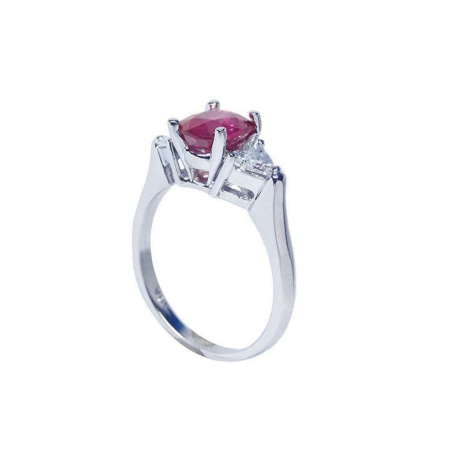 14k white gold ring with a deep red ruby and trillion side diamonds.