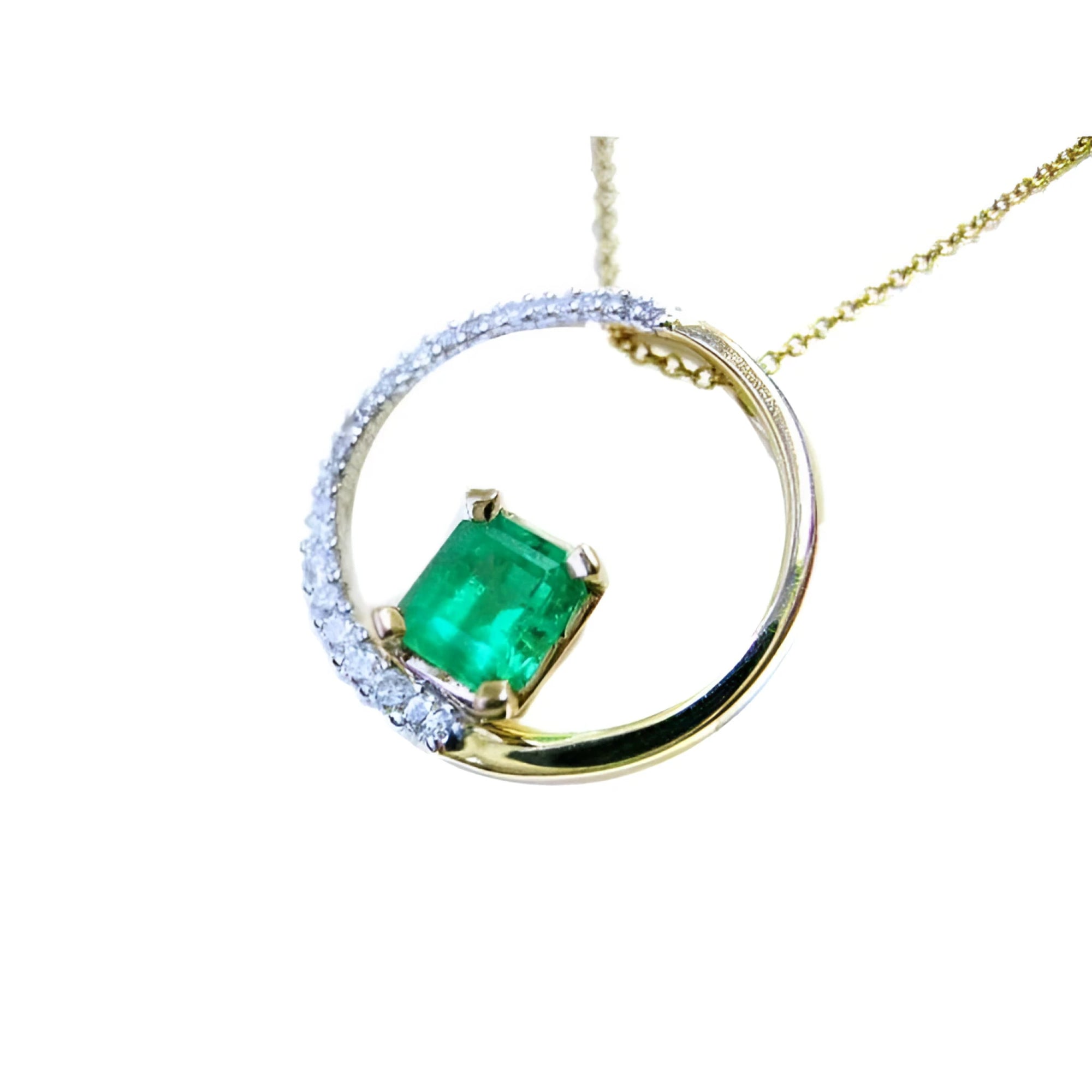 1.08 ct. emerald pendant in 14K gold, with a diamond pavé and polished band "Circle of Life" design.