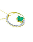 1.08 ct emerald and diamond circle pendant in 14K gold, with a half pavé diamond band.