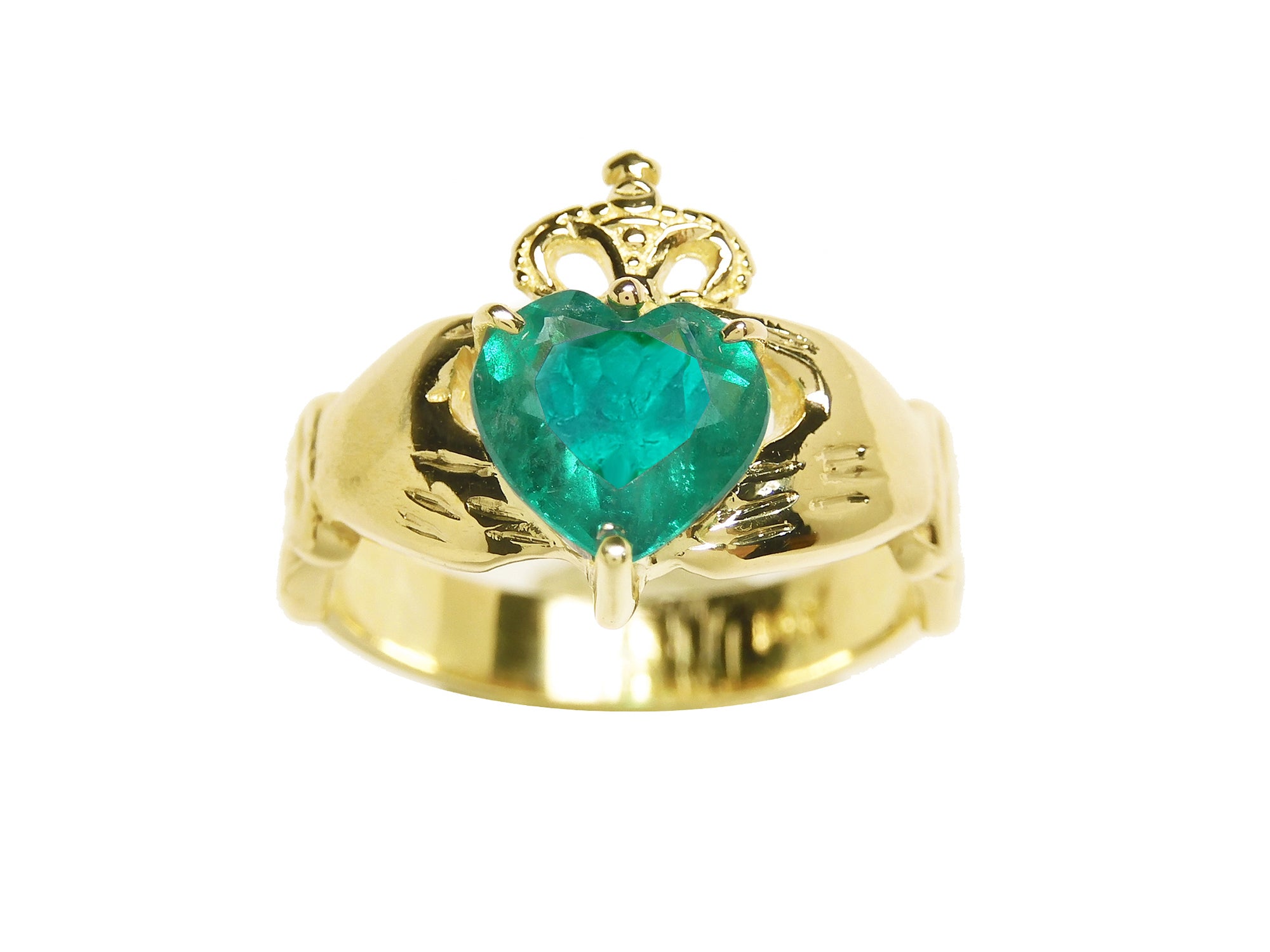 This heart emerald claddagh ring for women displays the topside profile on a white background.
