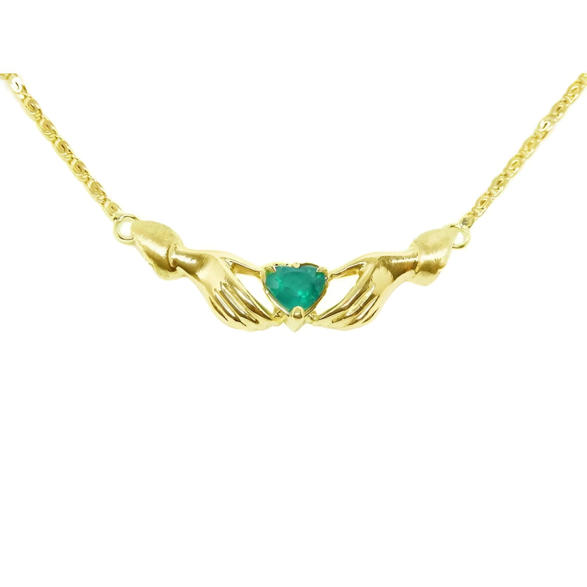 14K yellow gold Claddagh necklace with a deep green heart-cut emerald.