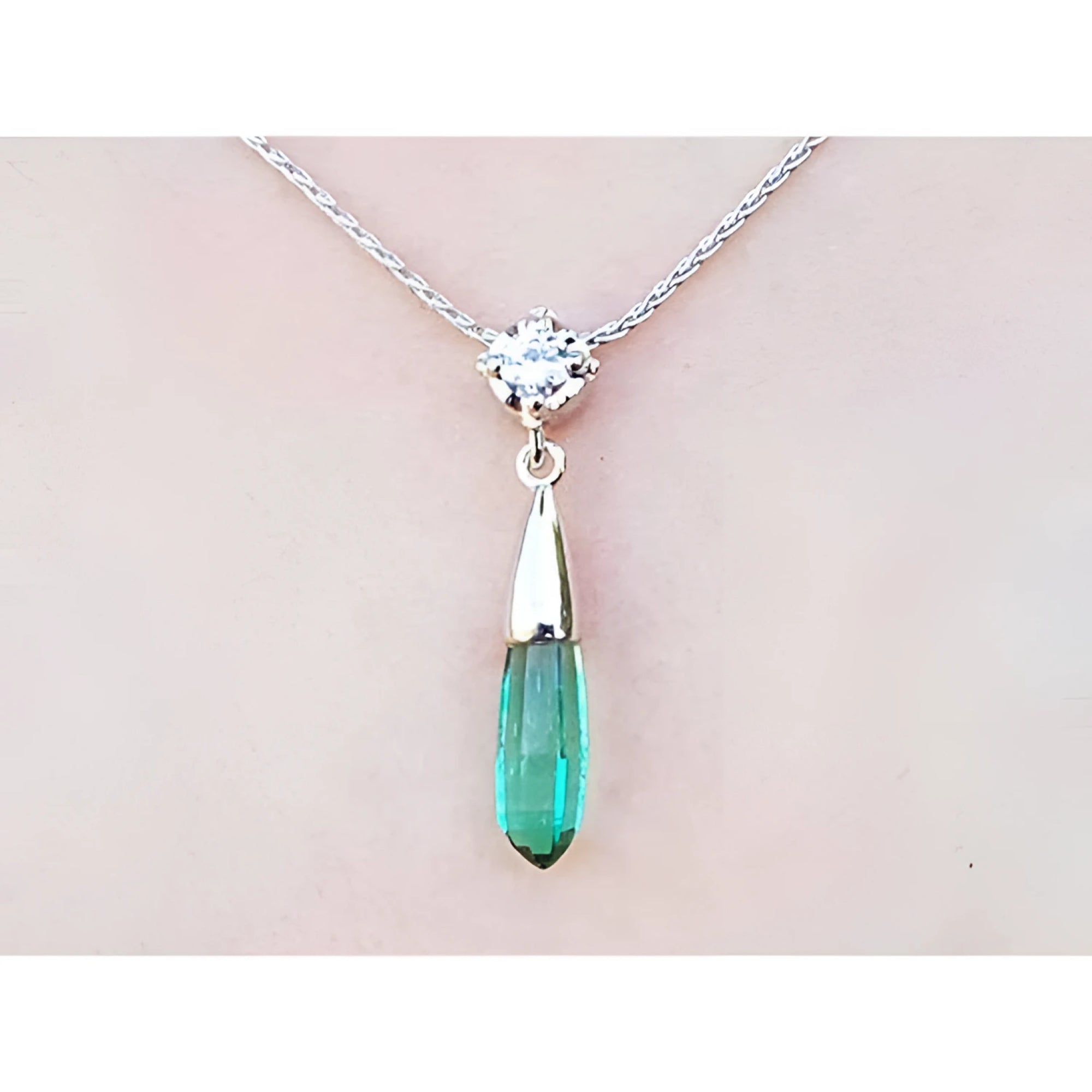 Colombian emerald briolette necklace with a sparkling bluish-green emerald and diamond slider in 14K white gold.