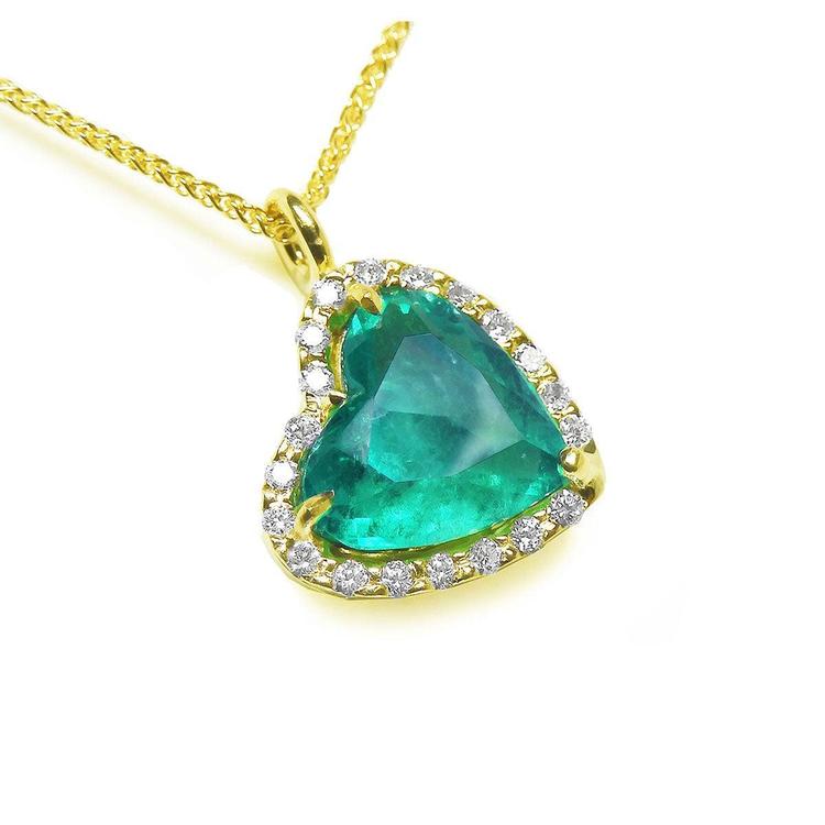18k yellow gold tilted heart emerald necklace with a halo diamond