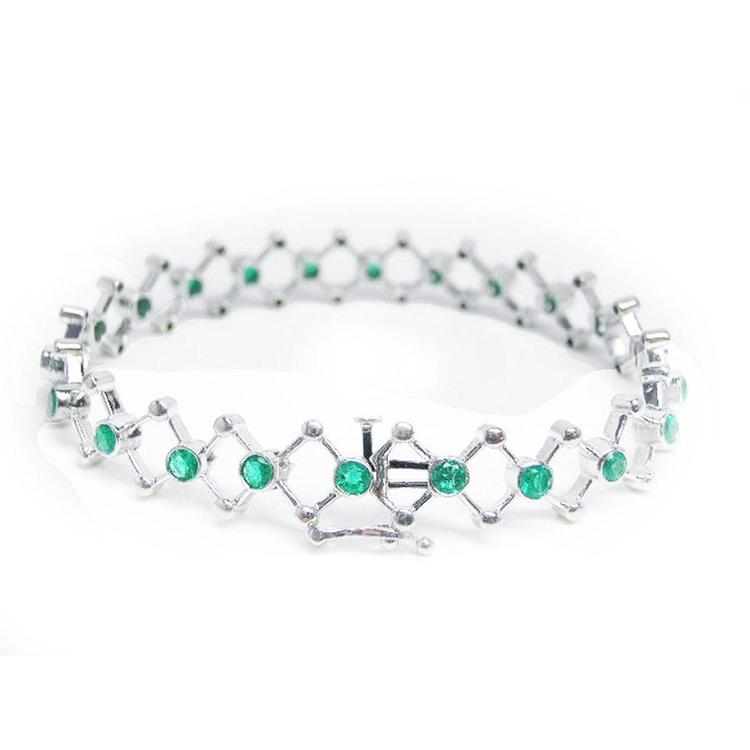 14K white gold bracelet with round Colombian emeralds bezel-set in diamond-shaped links.