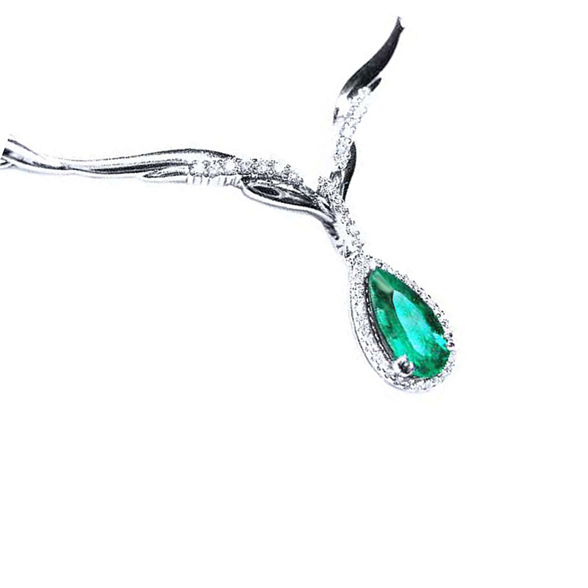 Close view of a pear cut emerald necklace sourced from Muzo mines crafted in 14k white gold, on a white background