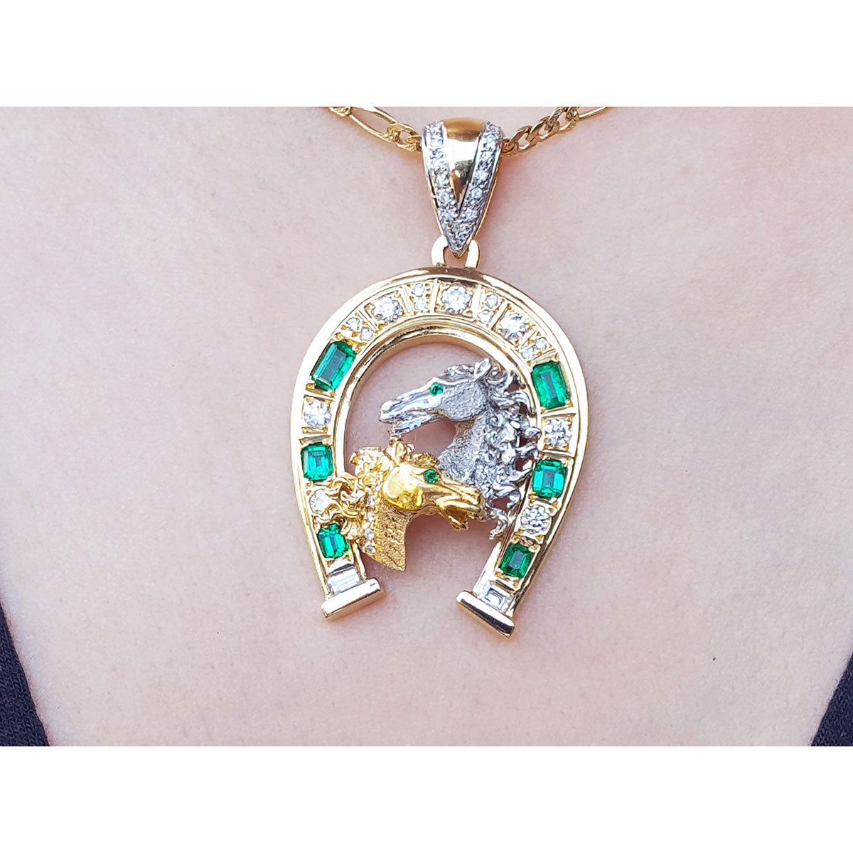 From Muzo natural emeralds horseshoe pendant and natural diamonds crafted in 18k yellow gold