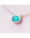 Yellow gold Emerald necklace for women from Muzo mines Colombia halo natural diamonds, crafted in 14k