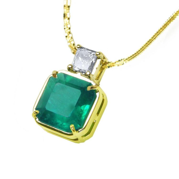 18K yellow gold necklace with a large asscher cut Colombian emerald and a princess cut diamond.