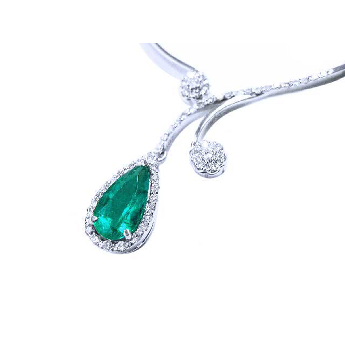 A closer left side view of a white gold necklace with a genuine teardrop emerald pendant on a white background