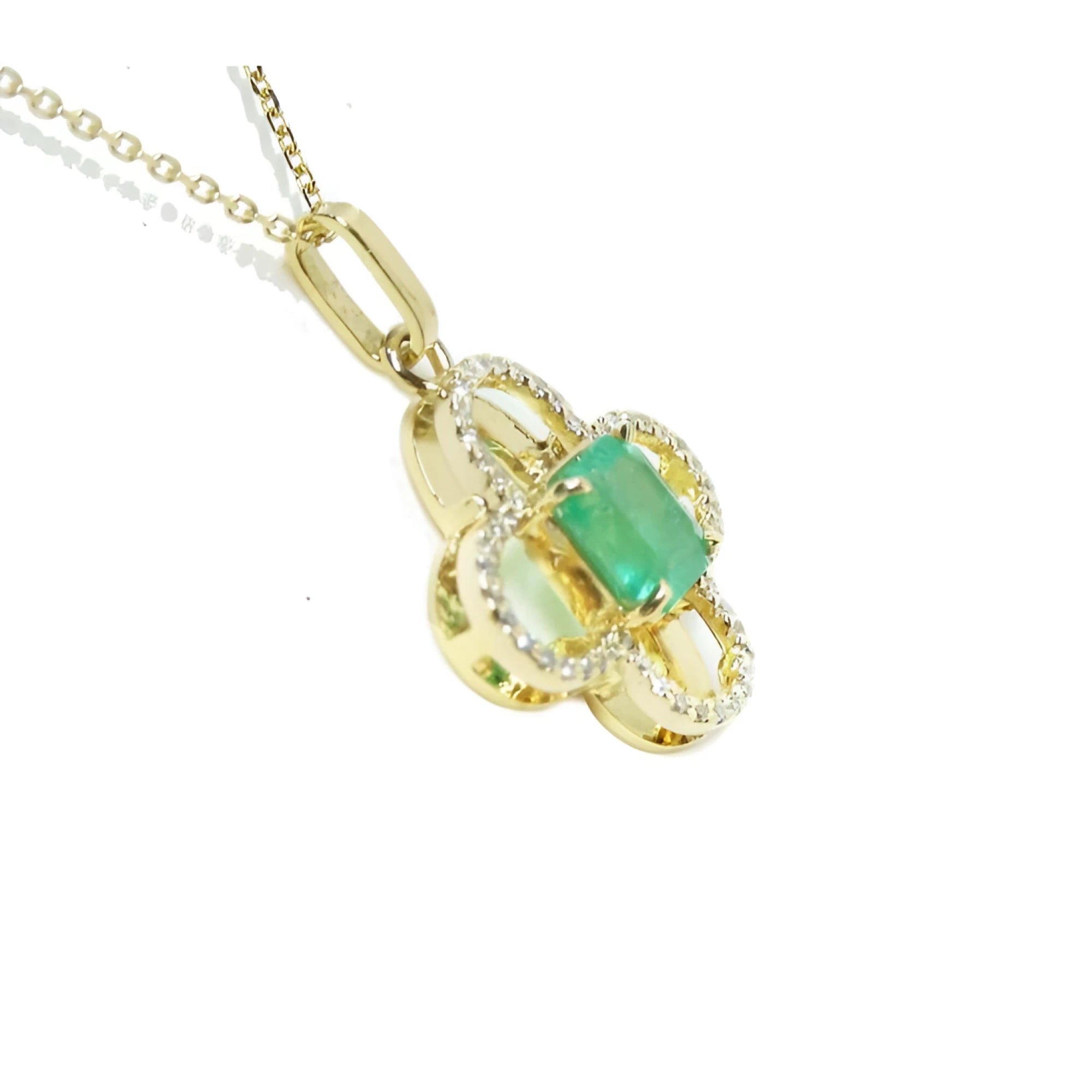 14K gold clover pendant with a square emerald and diamond accents on a delicate chain.