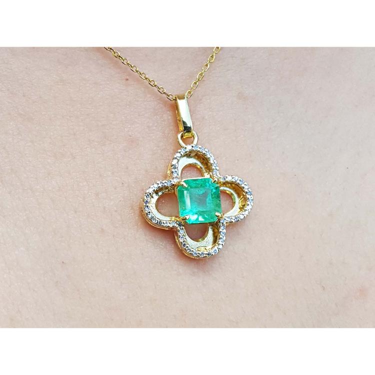 14K gold clover pendant with a square Colombian emerald and natural diamonds on a chain.