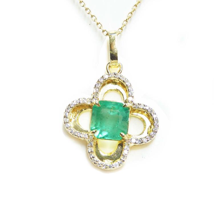 14k gold pendant with a natural colombian emerald and diamonds on a four-leaves clover design.