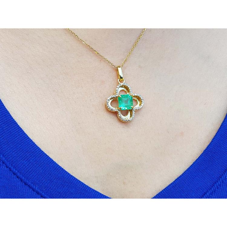 14K gold clover pendant with a square Colombian emerald and diamond accents on a chain.