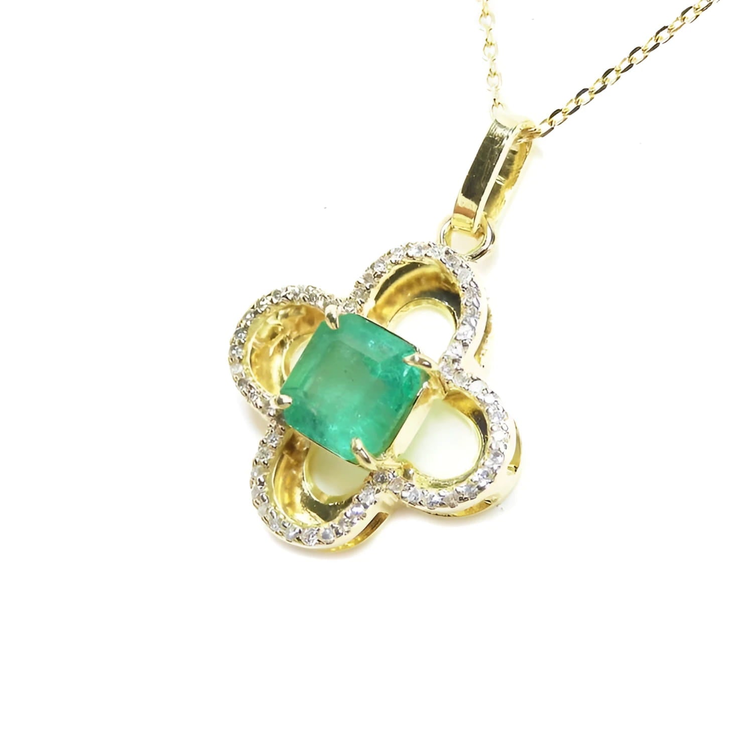 14K gold clover pendant with a square natural emerald and diamond accents.