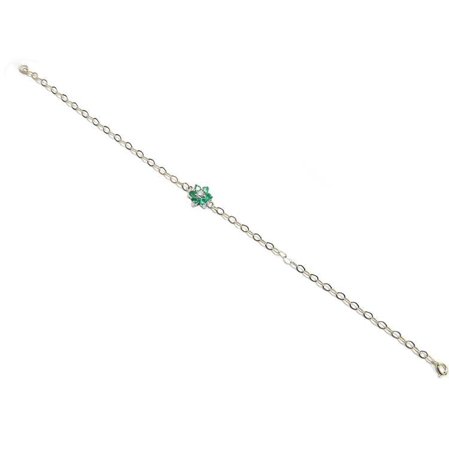 14K yellow gold bracelet with a central cluster of six green emeralds and one diamond.