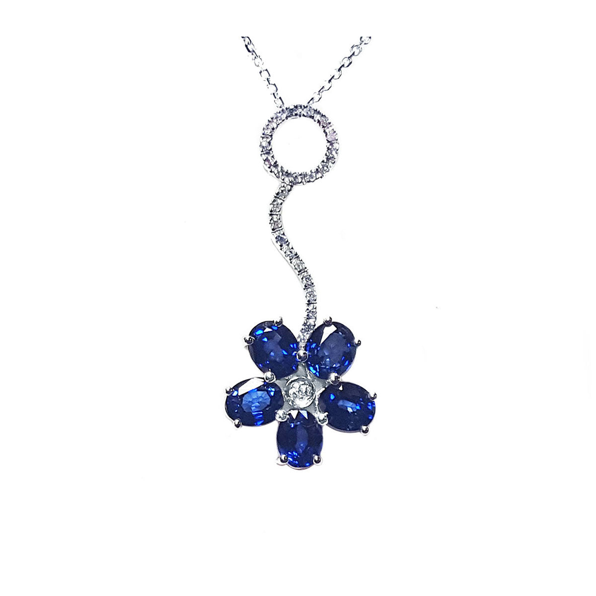 Frontal position of a cluster of natural sapphires pendant white gold necklace full top view