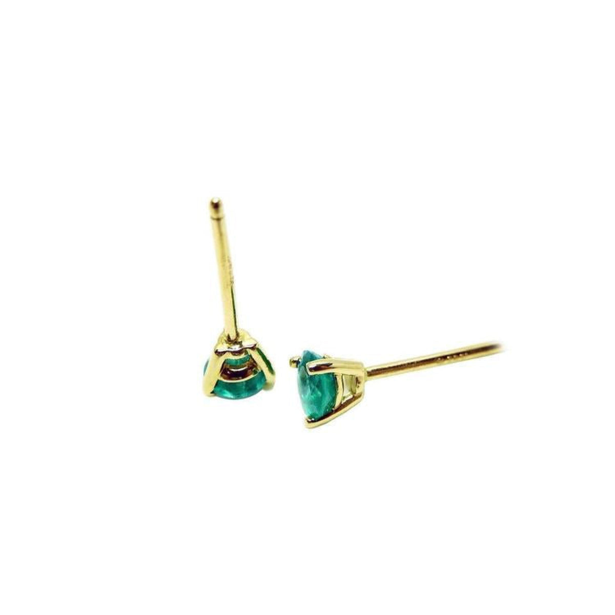 Medium deep natural emerald stud earrings in three-prong 14K yellow gold setting.