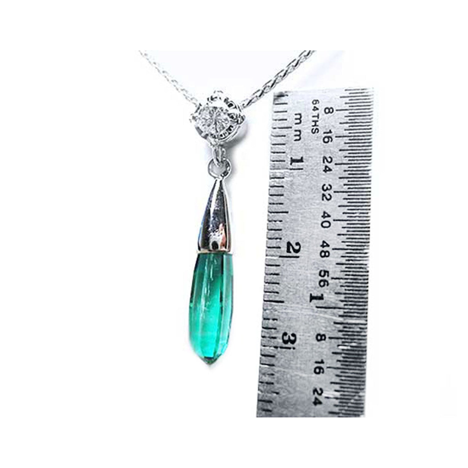 Colombian emerald briolette necklace with a bluish-green drop pendant and diamond slider on 14K white gold chain, next to a ruler.