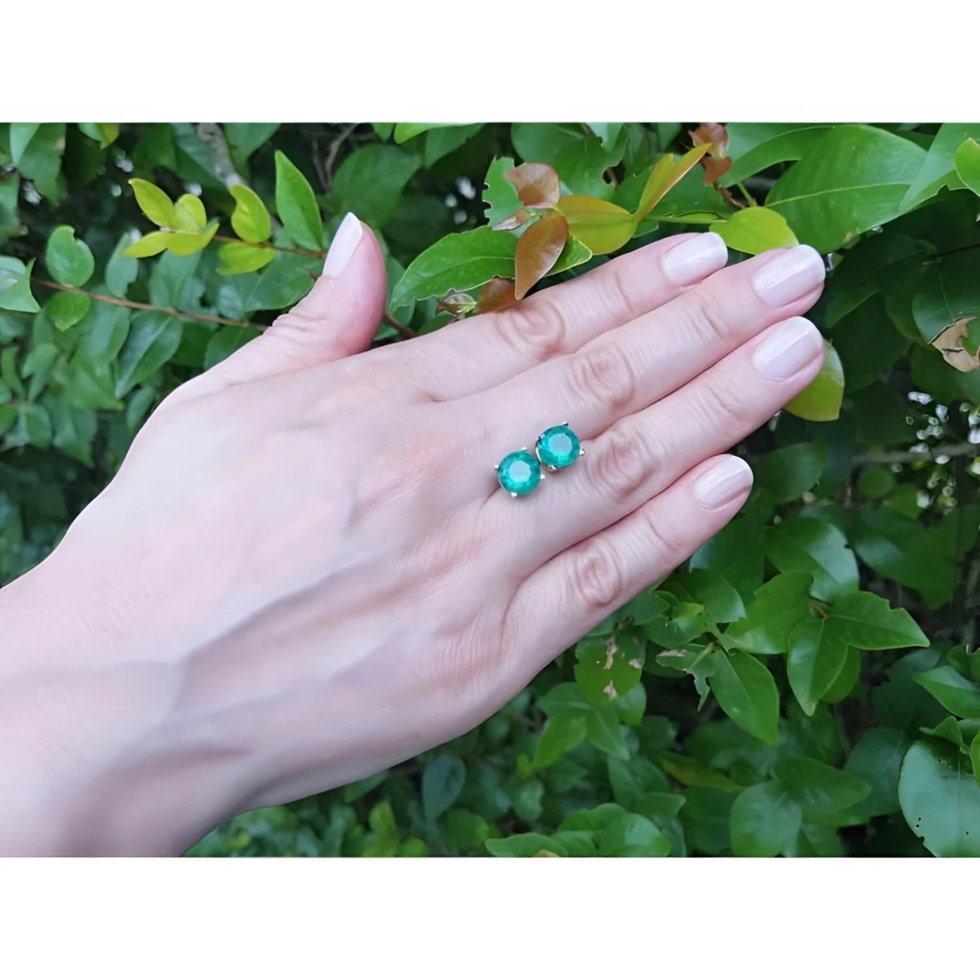 Colombian emerald stud earrings, 4.38 ct round bluish-green, in 14K yellow gold prong settings.
