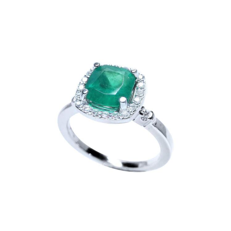 1.71 ct. Colombian emerald cushion cut halo diamond ring in 14K white gold.