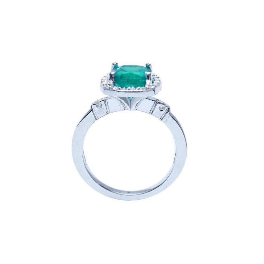 1.71 ct Colombian emerald cushion cut ring with diamond halo in 14K white gold.