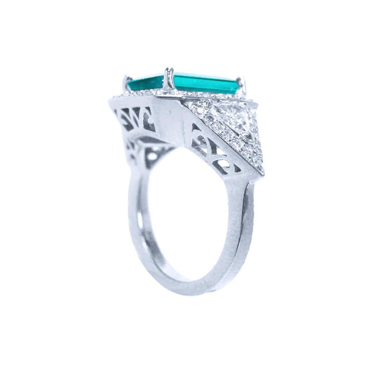 This 18k white gold GIA certified emerald ring for women is visible its underside gallery and shoulder side,