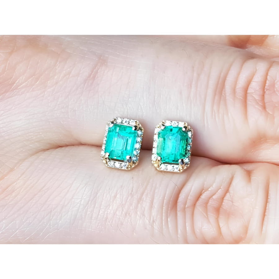 1.41 ct. rectangular Colombian emerald halo stud earrings with diamonds in 14k yellow gold.