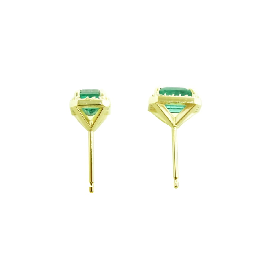 1.41 ct. natural Colombian emerald halo stud earrings in 14k yellow gold.