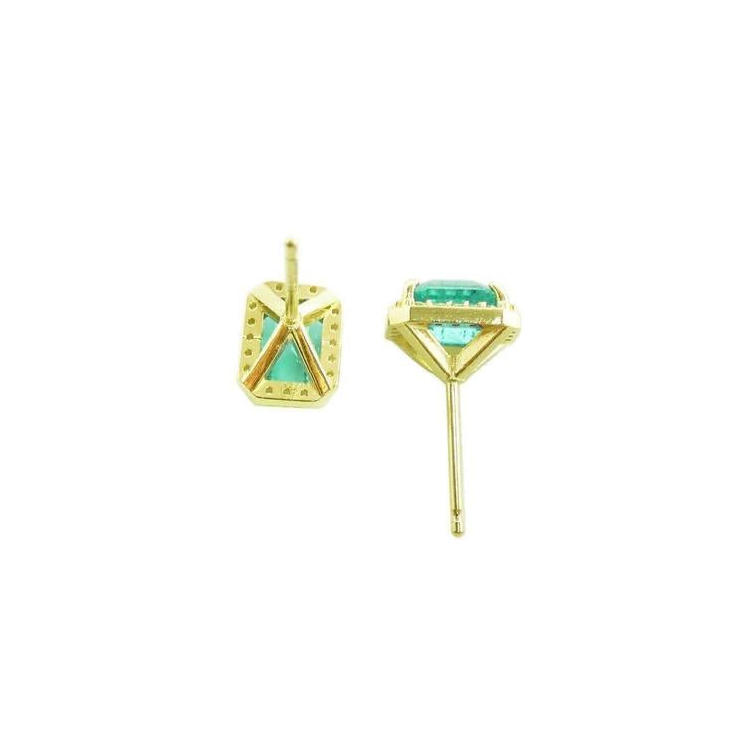 14k yellow gold stud earrings with rectangular Colombian emeralds and diamond halos.