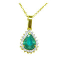18k gold pendant with a natural teardrop colombian emerald surrounded by a halo diamond.